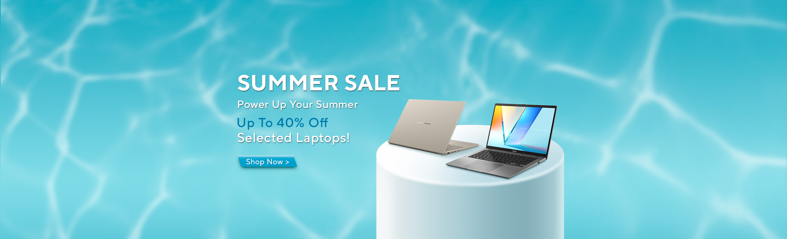2 silver ASUS laptops on a cylindrical plinth against a watery blue background