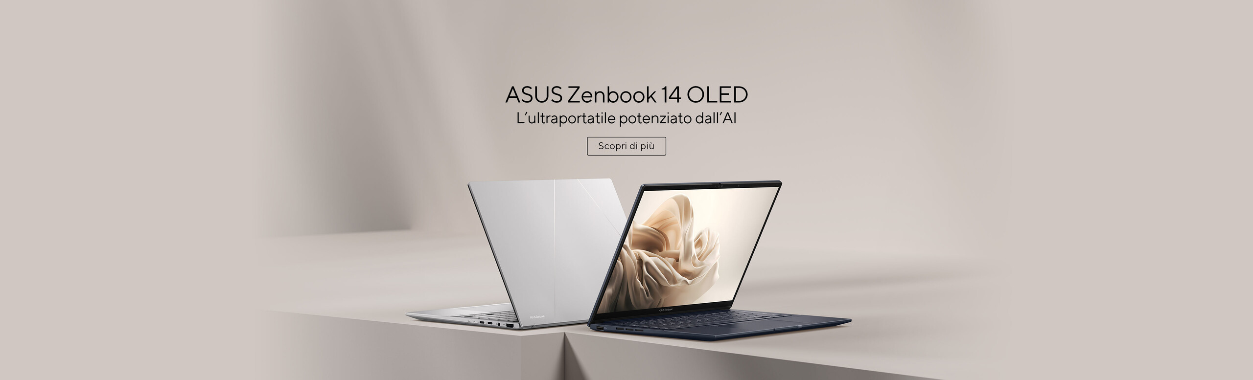L'immagine mostra due laptop ASUS Zenbook 14 OLED disposti su una superficie liscia. Uno è aperto, mostrando lo schermo con un'immagine artistica, mentre l'altro è chiuso