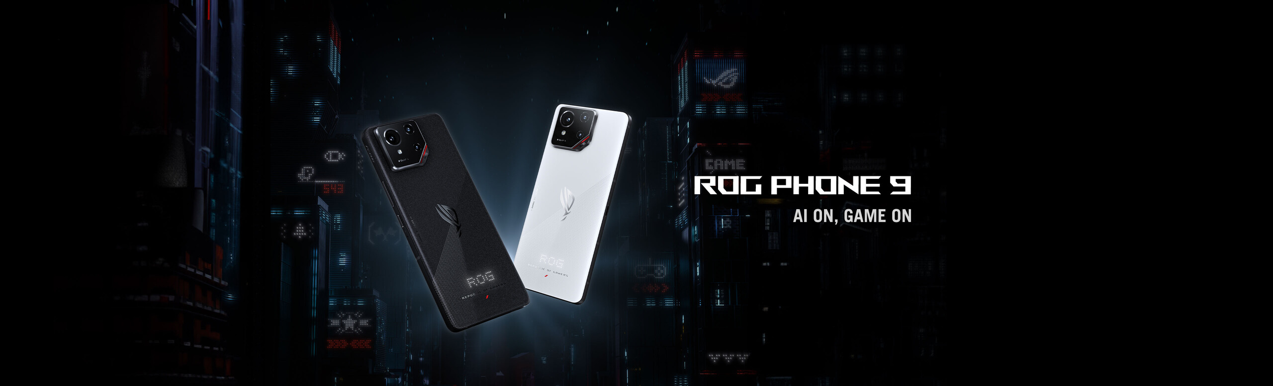 L'immagine mostra due smartphone ROG Phone 9, uno nero e uno bianco, su uno sfondo scuro con dettagli tecnologici. Il design è elegante e moderno, con la dicitura ROG PHONE 9 AI ON, GAME ON visibile accanto ai telefoni.