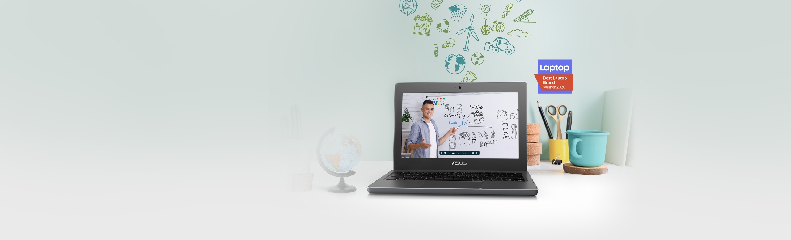 Laptop pentru educatie ASUS BR1100C deschis pe un birou cu rechizite in fundal
