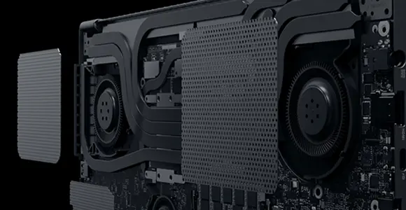 A close-up render of the ROG Flow X16 motherboard with its cooling system attached, and two dust filters floating above the fans