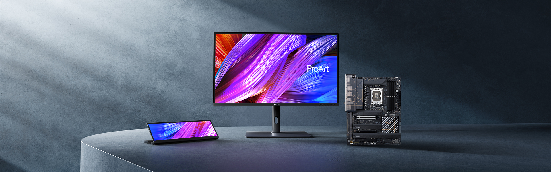 ProArt motherboard and displays on a table