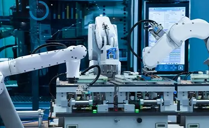 An automated factory scene with 3 robotic arms.